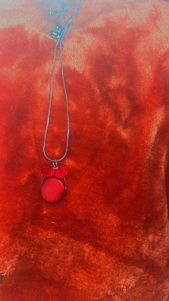 red and silver necklace